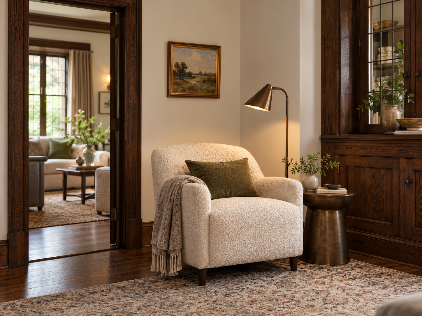 A reading chair and lamp placed against a useful wall beside retained oak millwork.