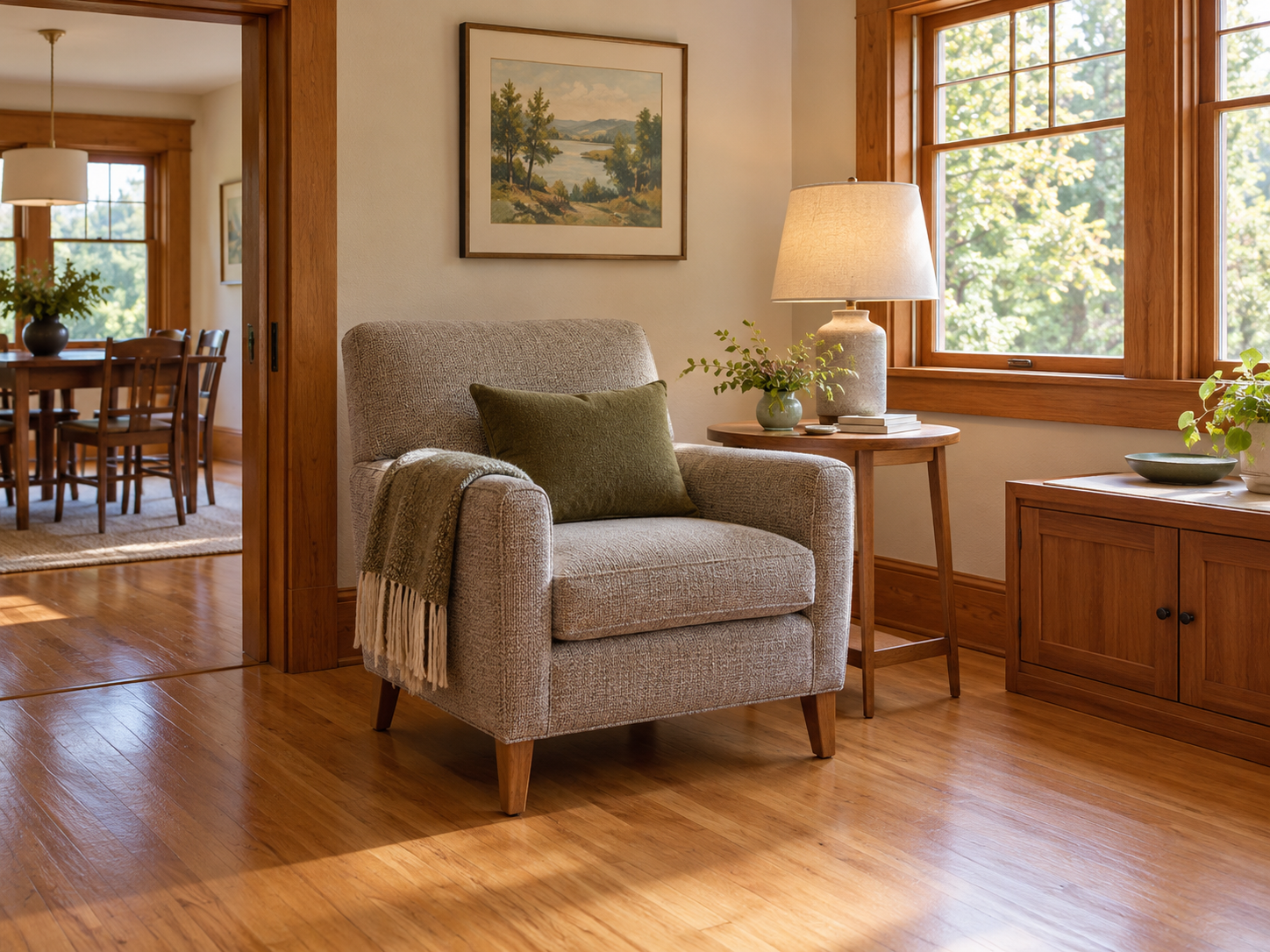 A comfortable chair, side table, lamp and everyday storage arranged beside a wide doorway.